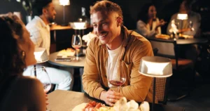 Couple enjoying dinner and wine at a romantic Montreal restaurant